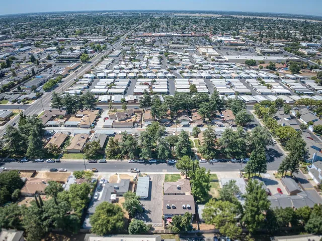 an aerial view of residential houses with outdoor space