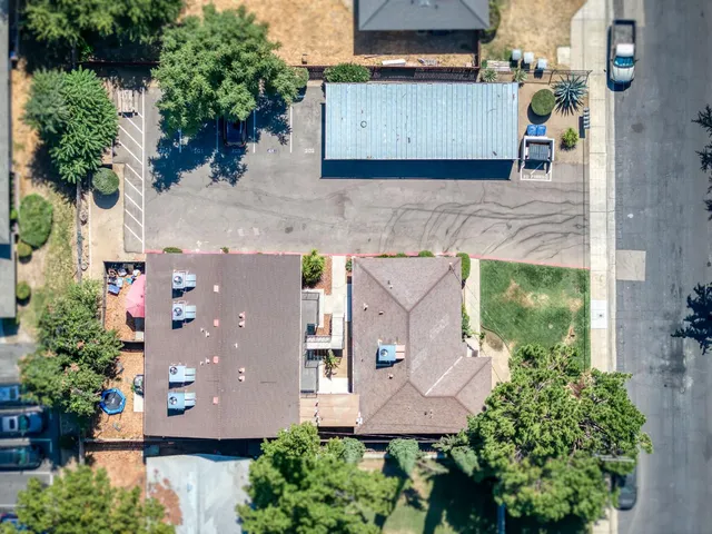 an aerial view of a house with outdoor space