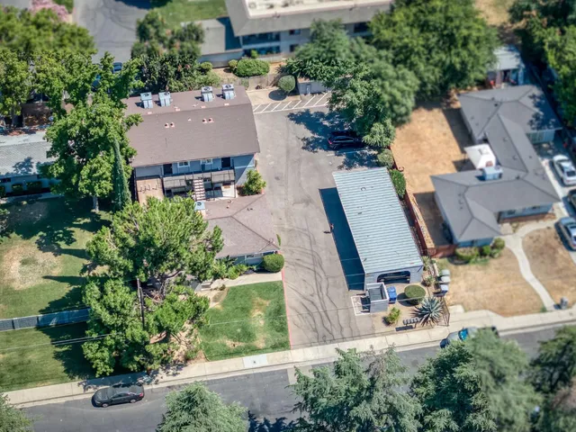 an aerial view of a house with outdoor space and street view