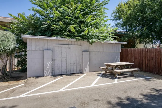 a backyard of a house with car parked