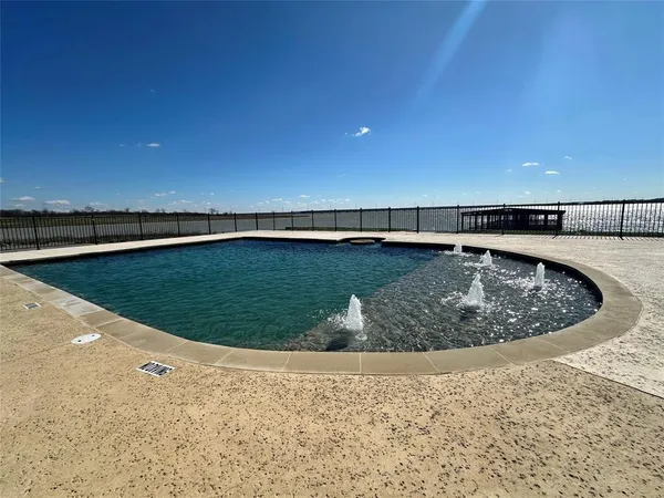 a view of a backyard with wooden floor and a ocean view