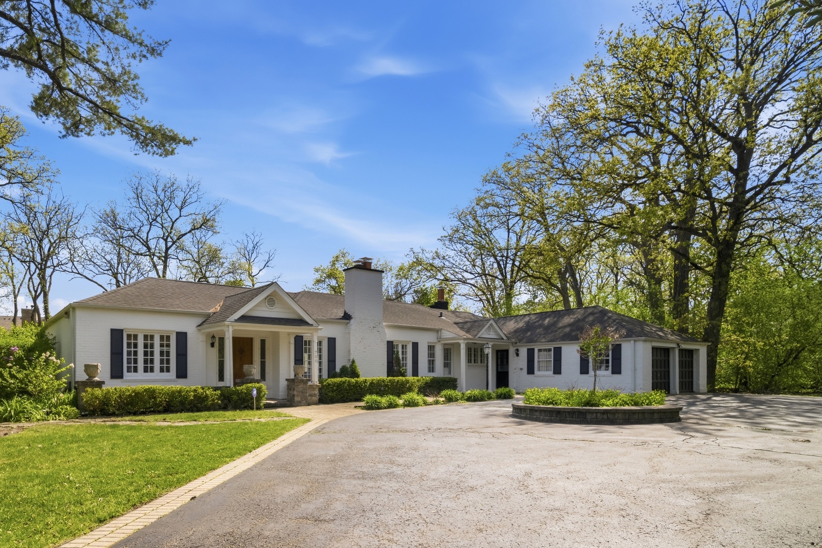 700 South Waukegan Road Lake Forest, IL 60045 - Photo 1 of 22 a front view of a house with a garden