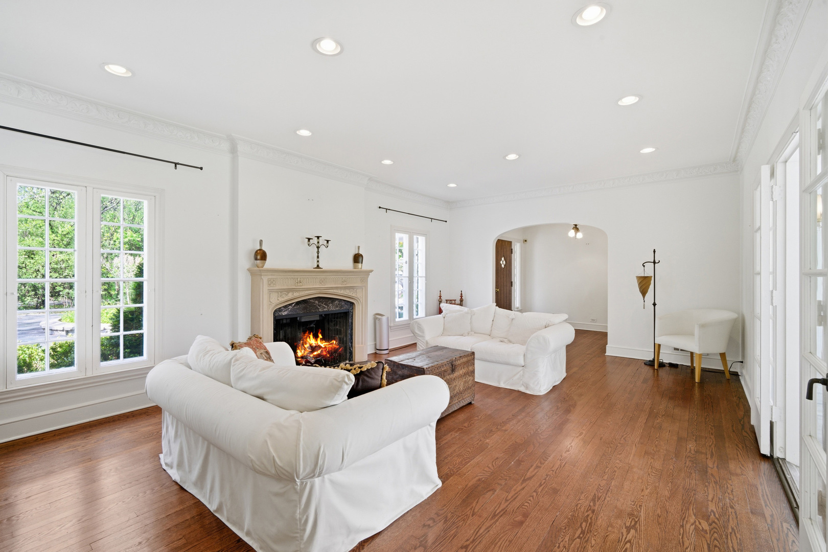 700 South Waukegan Road Lake Forest, IL 60045 - Photo 4 of 22 a living room with furniture a fireplace and a large window