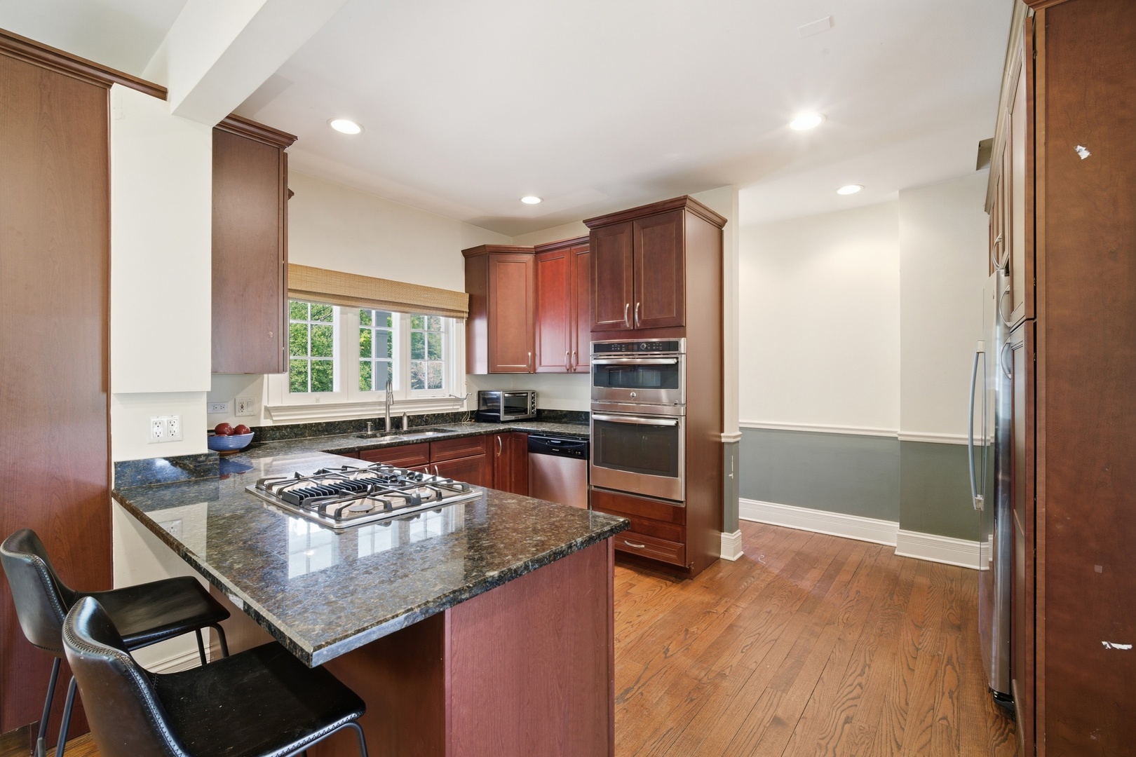 700 South Waukegan Road Lake Forest, IL 60045 - Photo 5 of 22 a kitchen with a sink stove and chairs