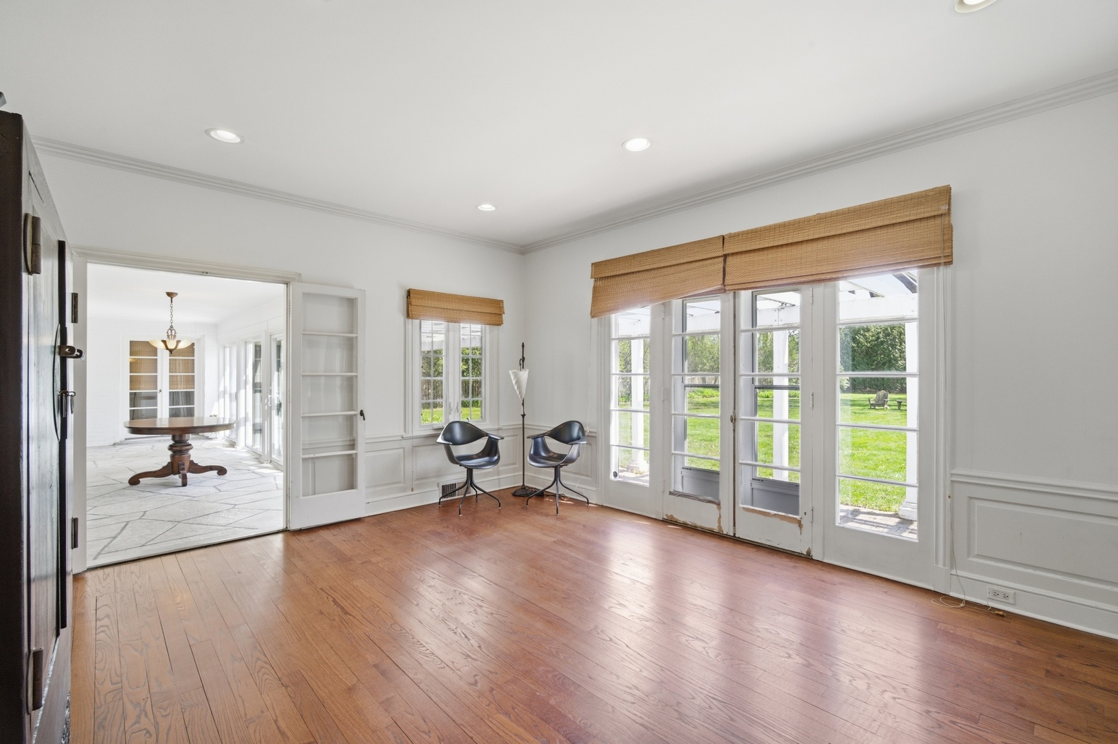 700 South Waukegan Road Lake Forest, IL 60045 - Photo 8 of 22 a view of an empty room with glass door and wooden floor