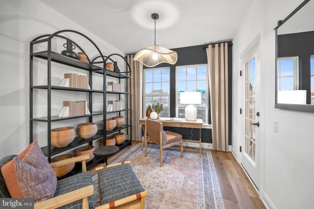 a view of a livingroom with furniture and a window