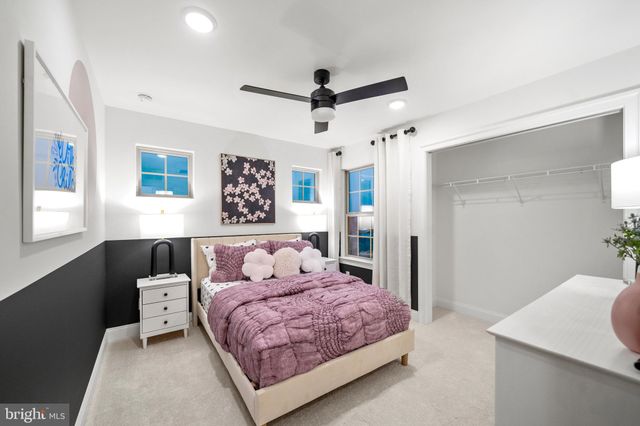 a bedroom with a large bed and a table