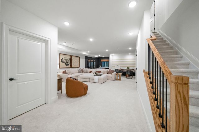 an entryway and livingroom with furniture