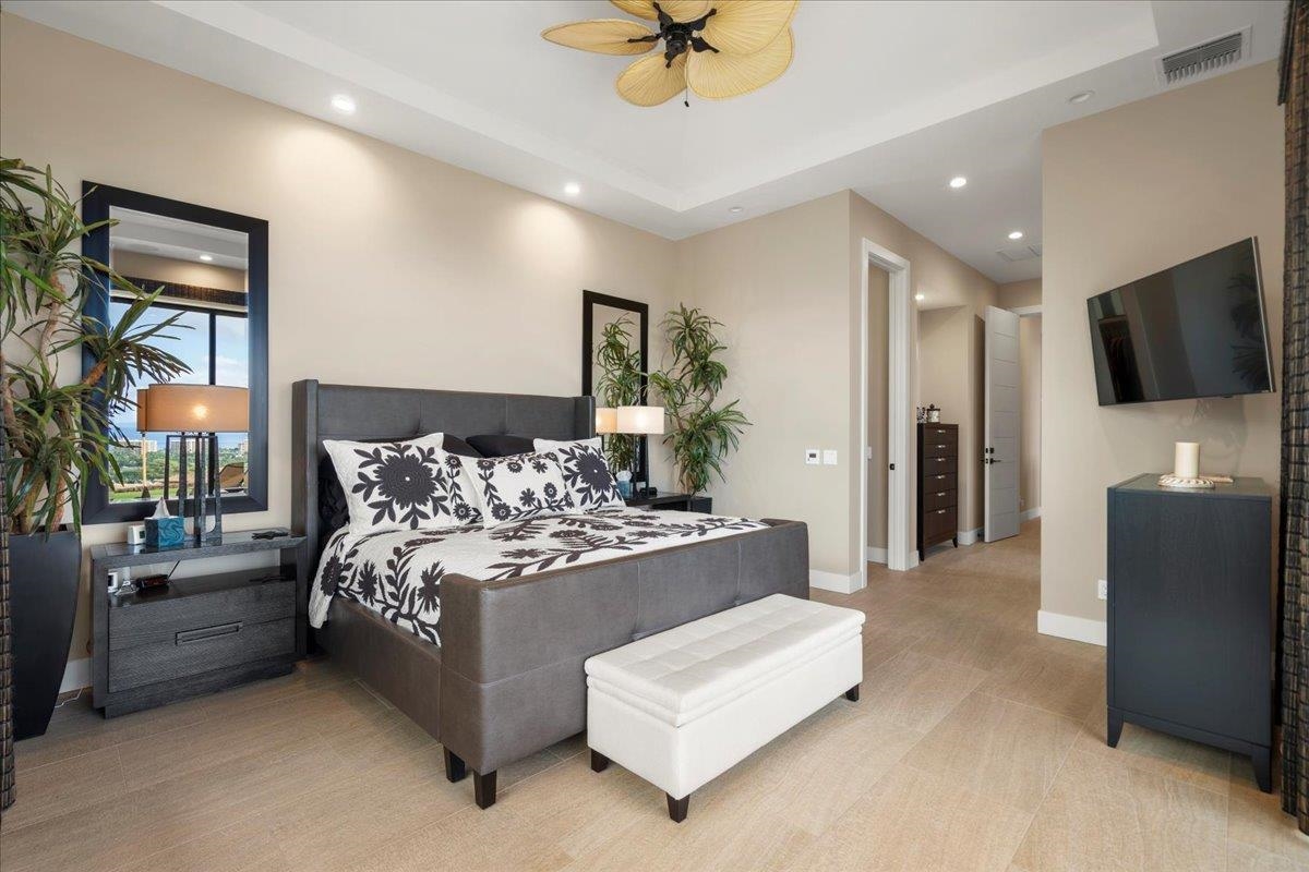 24 Anapuni Loop, Unit 2 Lahaina, HI 96761 - Photo 15 of 50 a living room with furniture and a flat screen tv