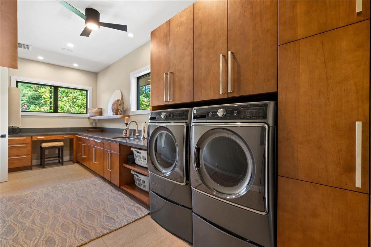 24 Anapuni Loop, Unit 2 Lahaina, HI 96761 - Photo 27 of 50 a kitchen with a refrigerator and a stove top oven