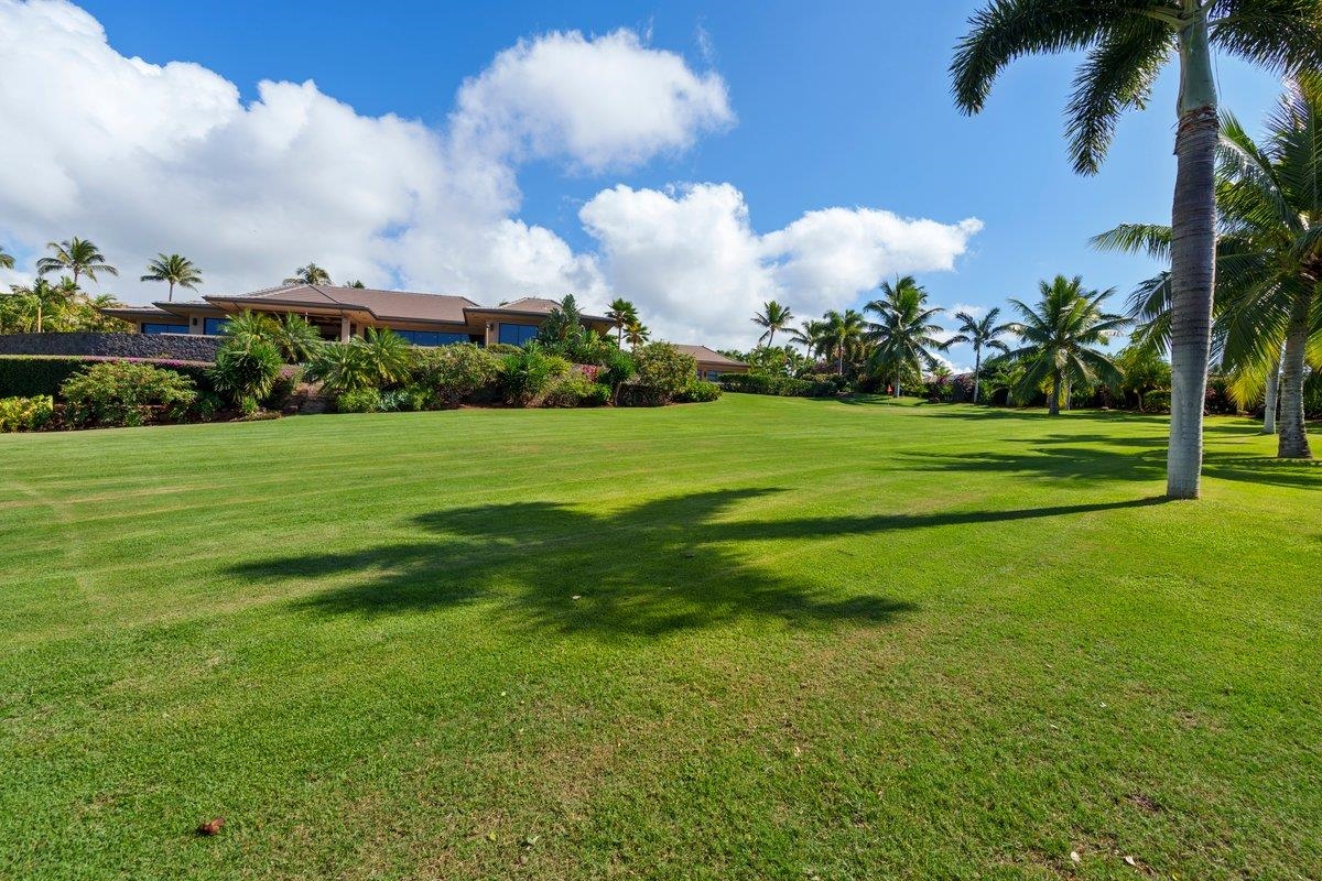 24 Anapuni Loop, Unit 2 Lahaina, HI 96761 - Photo 48 of 50 a view of a big yard with a fountain