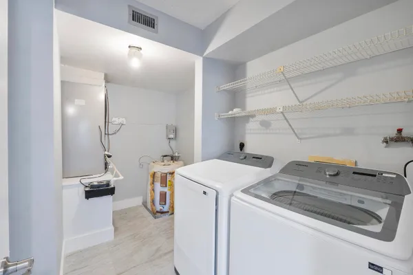 a utility room with dryer and washer