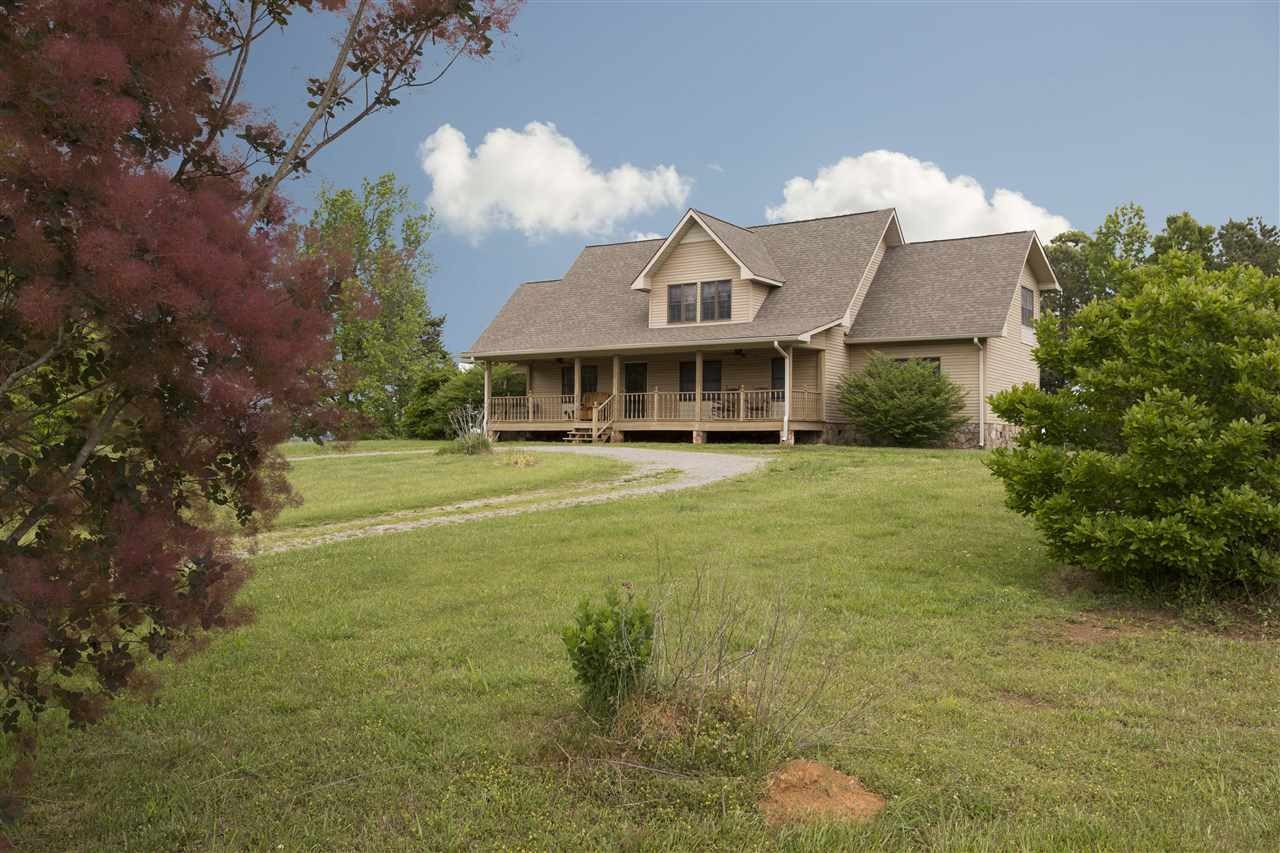550 Price Spring Spring City, TN 37381 - Photo 1 of 1 a front view of a house with garden