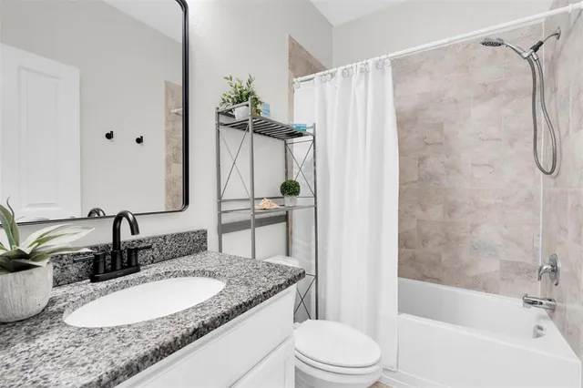 a view of a hallway with washer and dryer