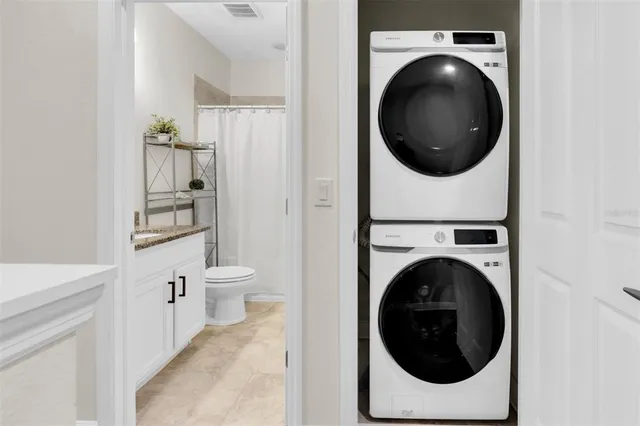 a front view of a house with a garage and a yard