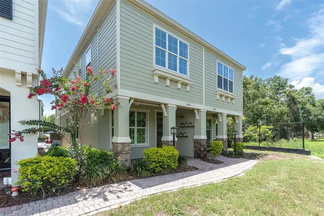 a front view of a house with garden