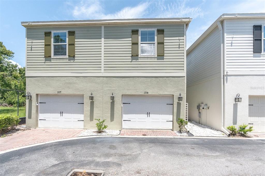 106 Cutlass Way Oldsmar, FL 34677 - Photo 21 of 23 a front view of a house with a garage and a yard