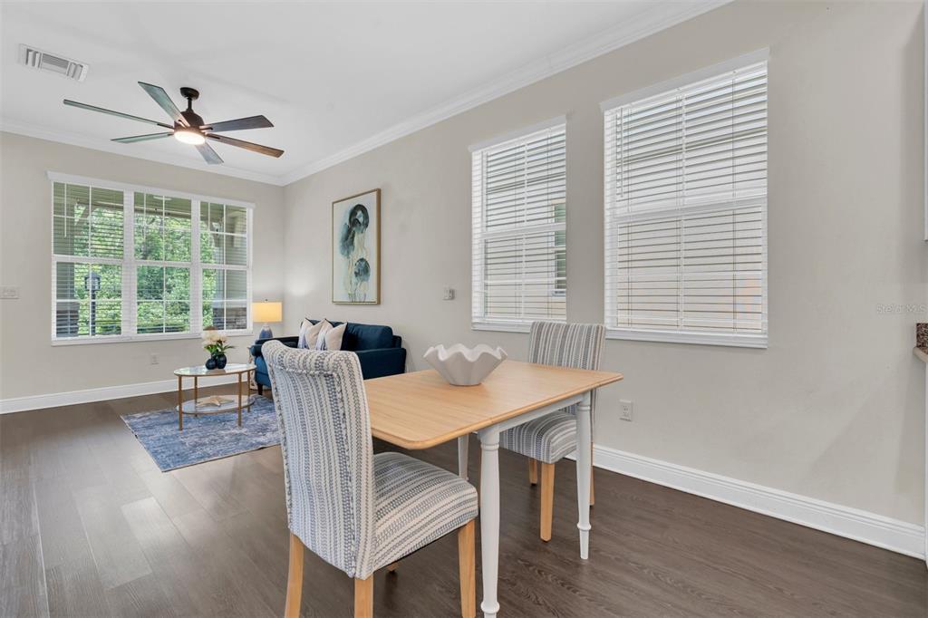 106 Cutlass Way Oldsmar, FL 34677 - Photo 10 of 23 a view of a dining room with furniture window and wooden floor