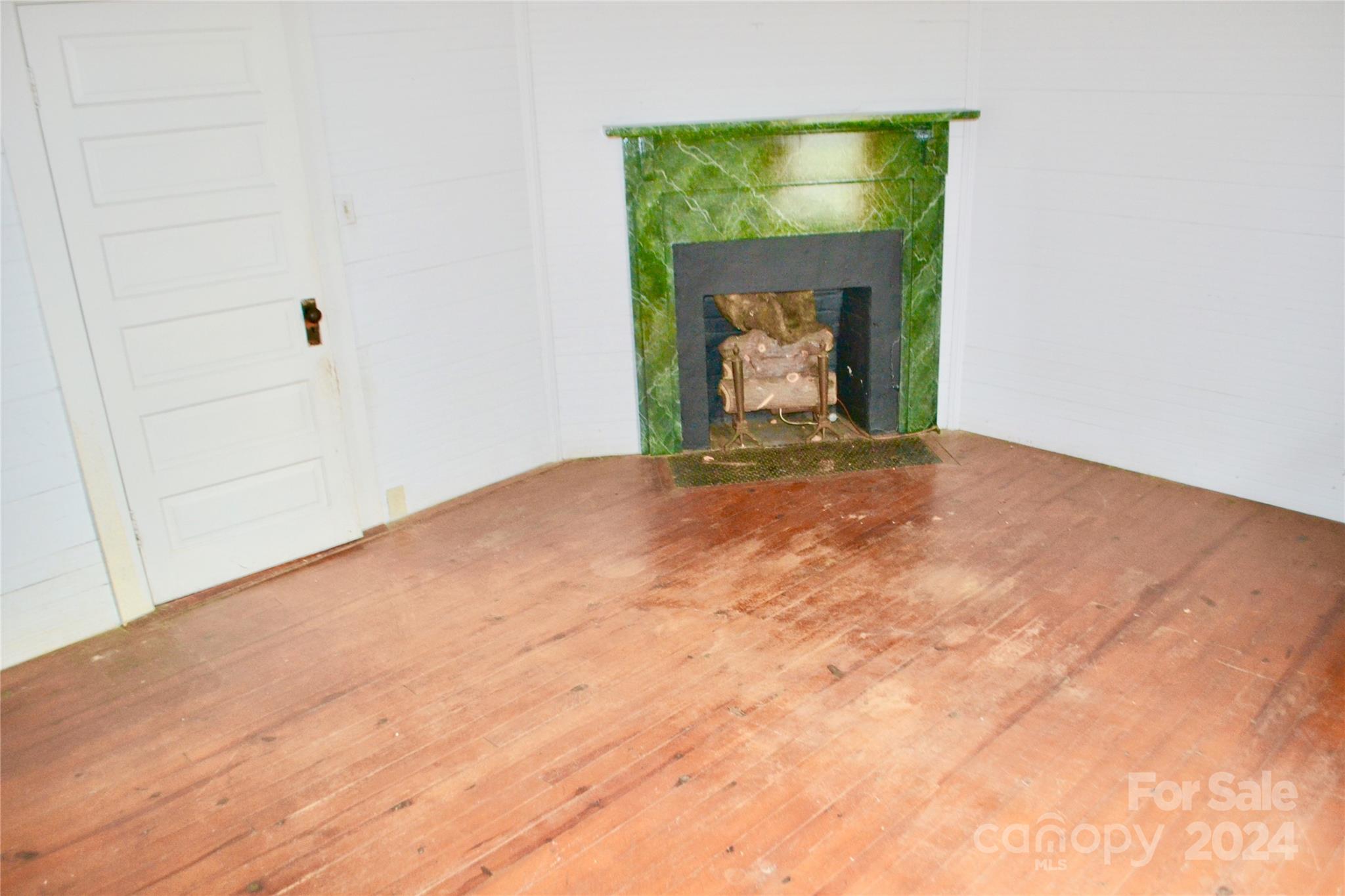 4298 Hudlow Road Rutherfordton, NC 28139 - Photo 24 of 38 a view of an empty room with a fireplace and a window