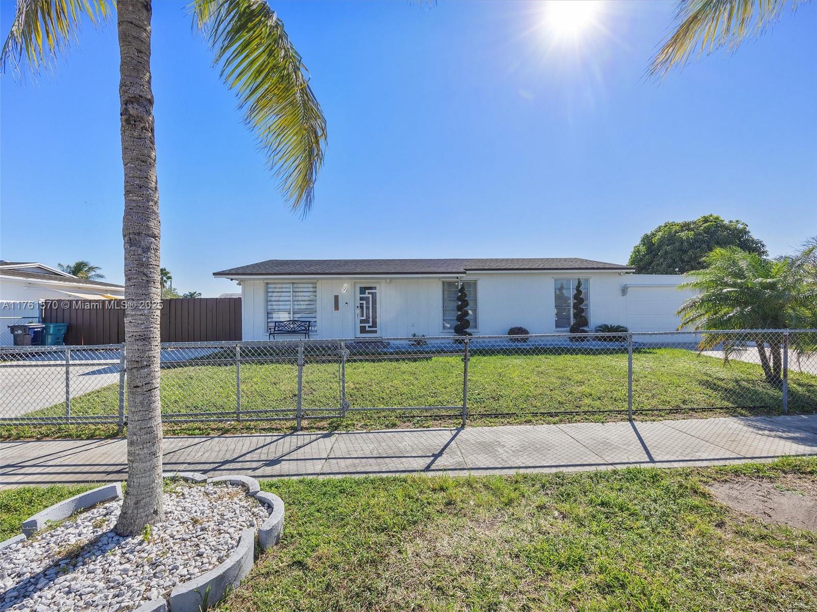 12744 Southwest 261st Terrace Homestead, FL 33032 - Photo 2 of 26 a view of house with a backyard