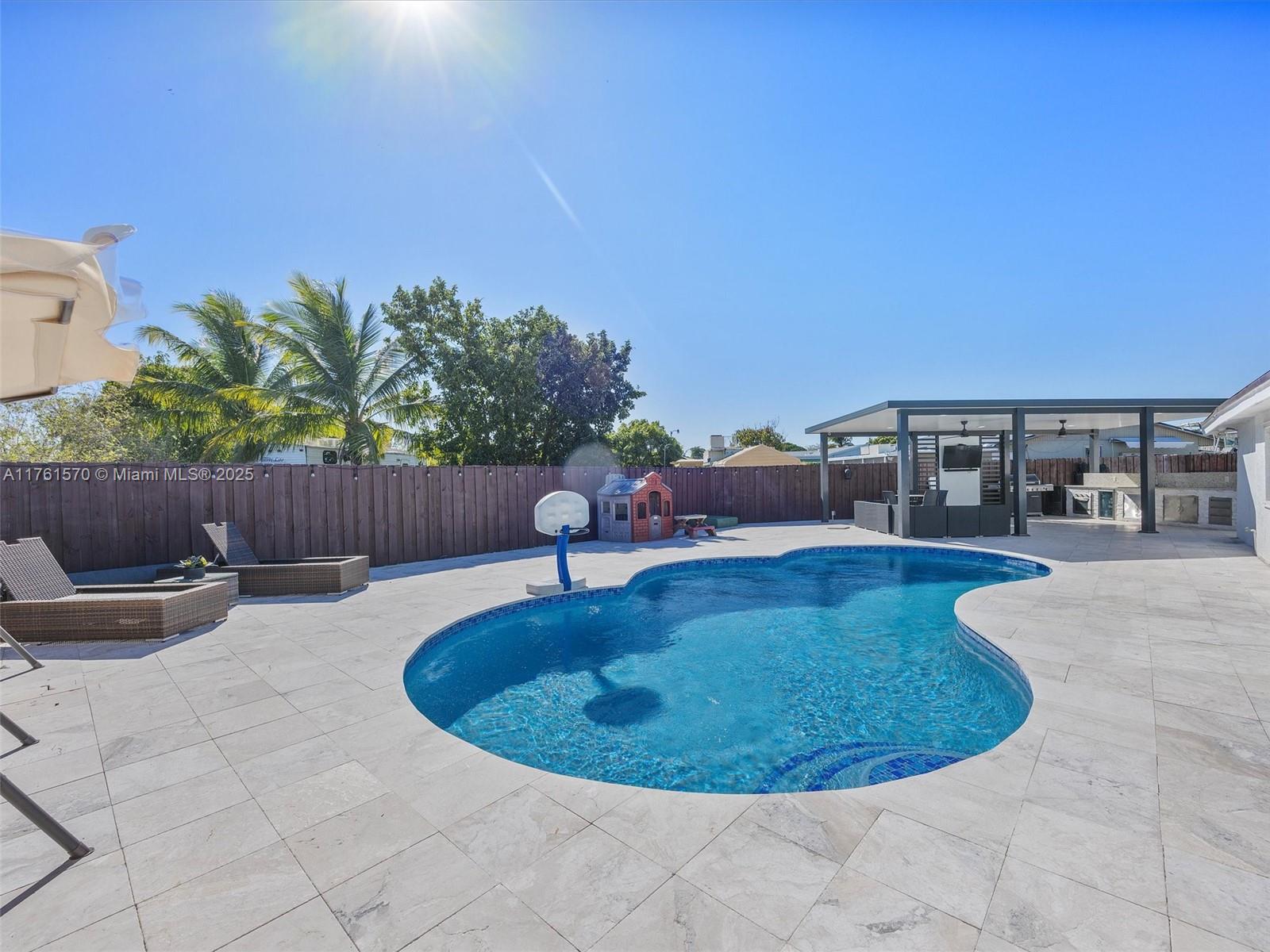 12744 Southwest 261st Terrace Homestead, FL 33032 - Photo 25 of 26 a view of swimming pool having outdoor seating