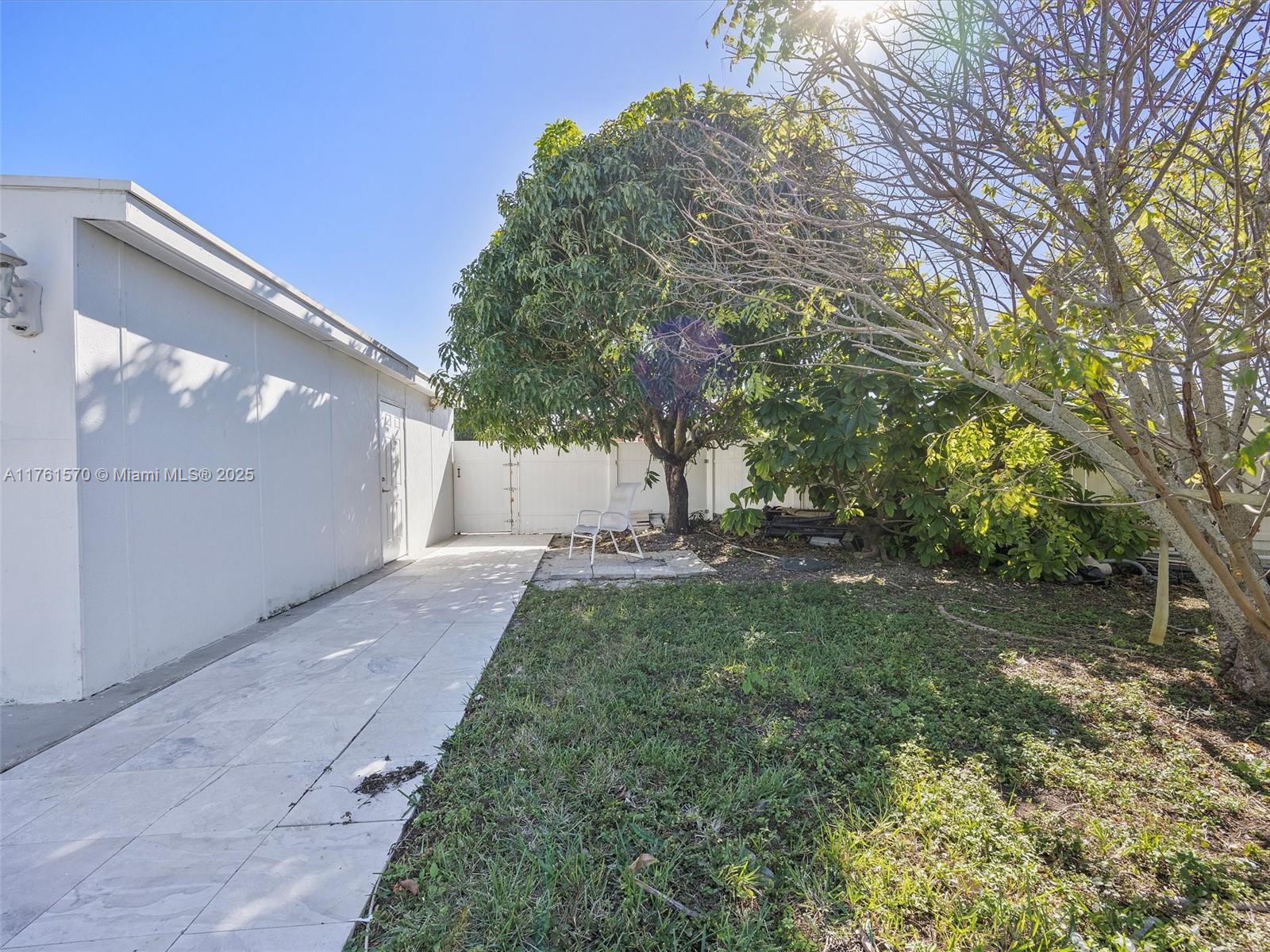 12744 Southwest 261st Terrace Homestead, FL 33032 - Photo 3 of 26 a view of a back yard