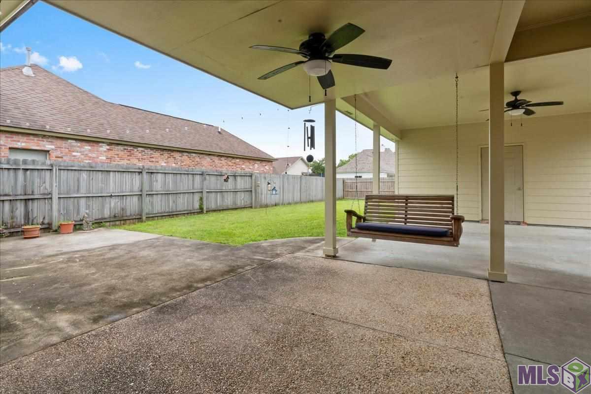 10223 Springpark Avenue Baton Rouge, LA 70810 - Photo 14 of 15 Covered patio with carport & storage room