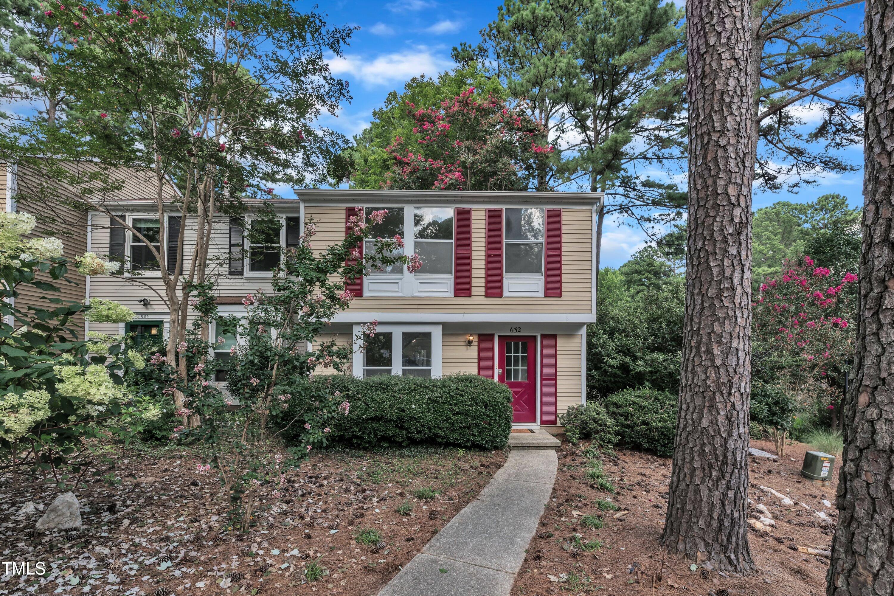 632 Middleton Avenue Cary, NC 27513 - Photo 33 of 34 a front view of a house with a garden