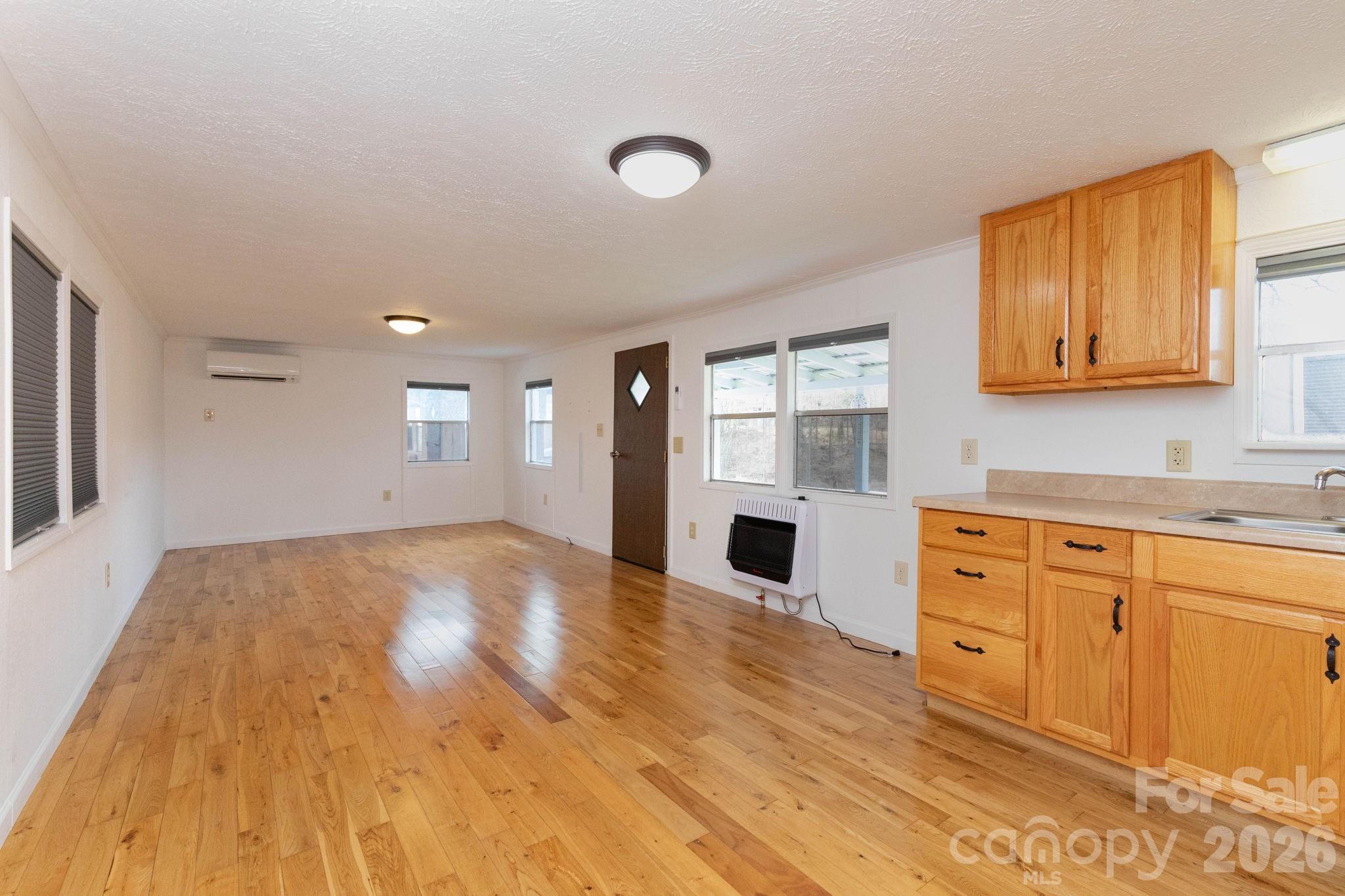 20 Ox Crk Road Weaverville, NC 28787 - Photo 17 of 22 a view of empty room with wooden floor and fan