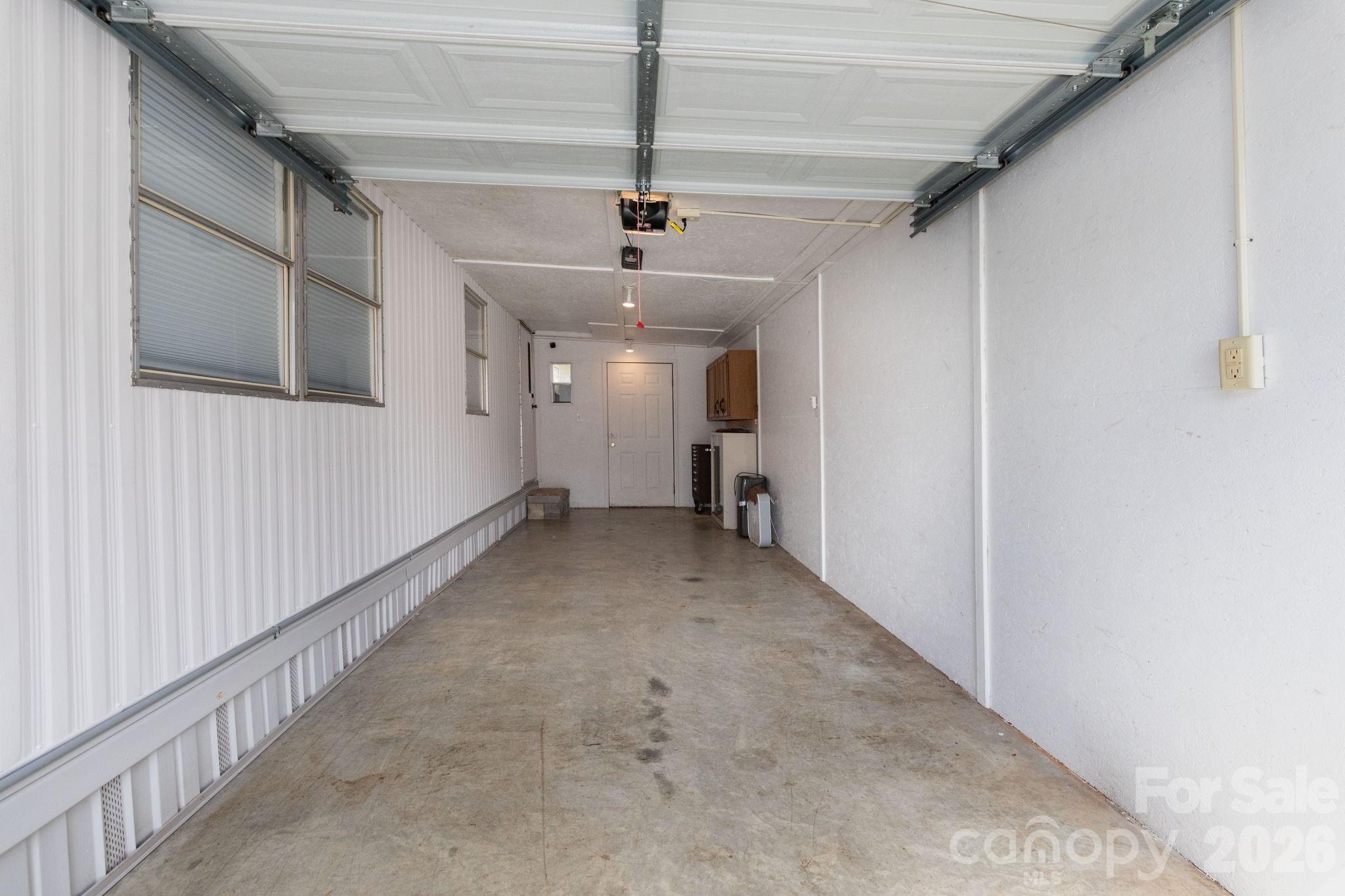 20 Ox Crk Road Weaverville, NC 28787 - Photo 9 of 22 a view of a hallway with a chandelier