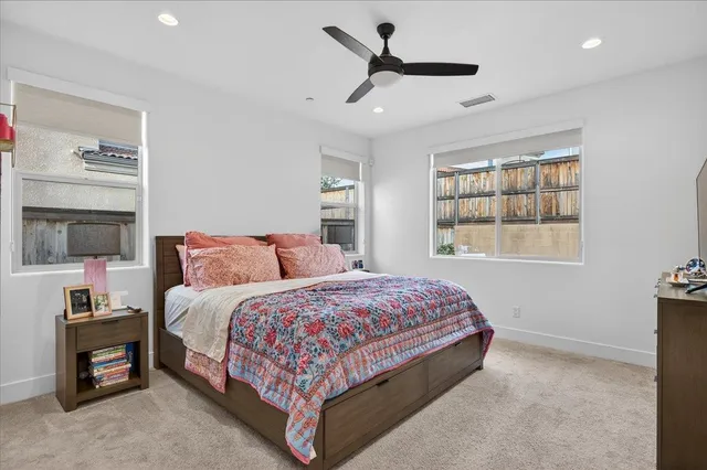 a bedroom with bed and a window