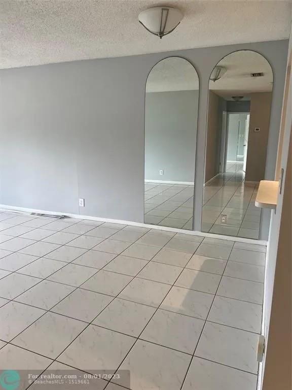 4131 Northwest 88th Avenue, Unit 206 Coral Springs, FL 33065 - Photo 11 of 41 a view of a livingroom with a furniture