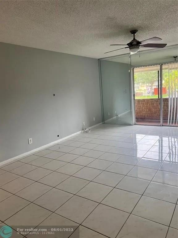 4131 Northwest 88th Avenue, Unit 206 Coral Springs, FL 33065 - Photo 12 of 41 a view of an empty room and window