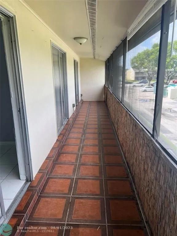 4131 Northwest 88th Avenue, Unit 206 Coral Springs, FL 33065 - Photo 16 of 41 a view of gallery with wooden floor