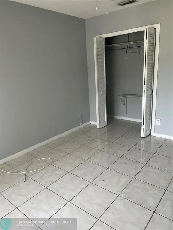4131 Northwest 88th Avenue, Unit 206 Coral Springs, FL 33065 - Photo 23 of 41 a view of an empty room