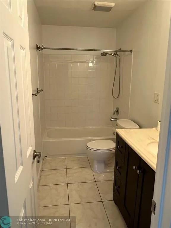 4131 Northwest 88th Avenue, Unit 206 Coral Springs, FL 33065 - Photo 24 of 41 a bathroom with a granite countertop shower a toilet and a sink