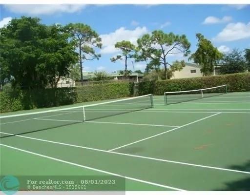 4131 Northwest 88th Avenue, Unit 206 Coral Springs, FL 33065 - Photo 34 of 41 a view of a tennis court