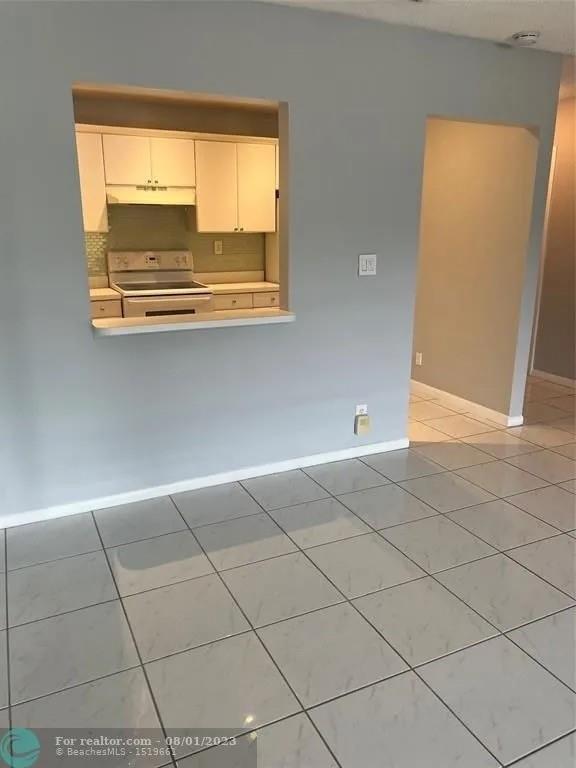 4131 Northwest 88th Avenue, Unit 206 Coral Springs, FL 33065 - Photo 5 of 41 a view of an empty room with a window