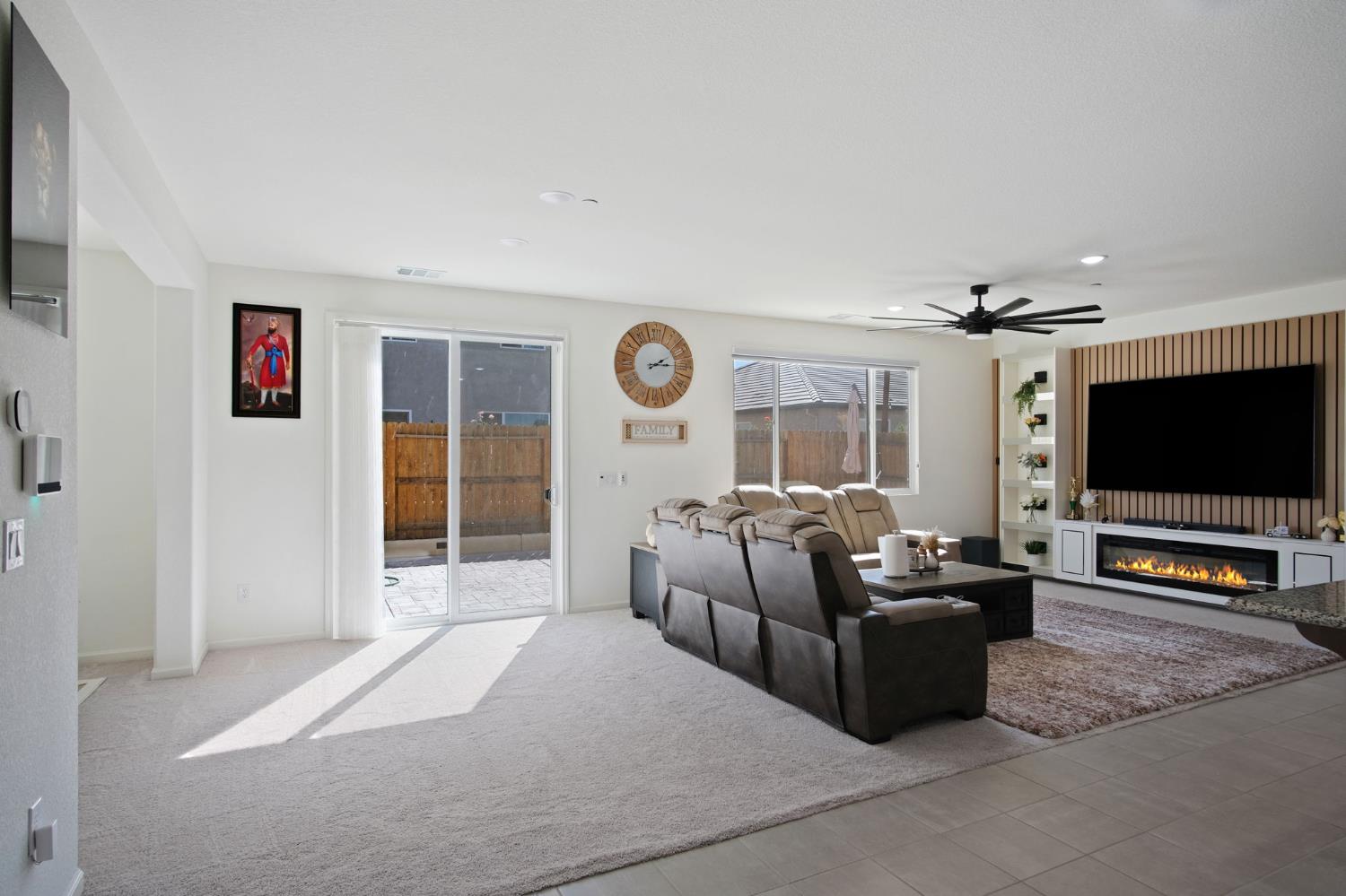 1432 Meridian Street Manteca, CA 95337 - Photo 11 of 42 a living room with furniture and a flat screen tv