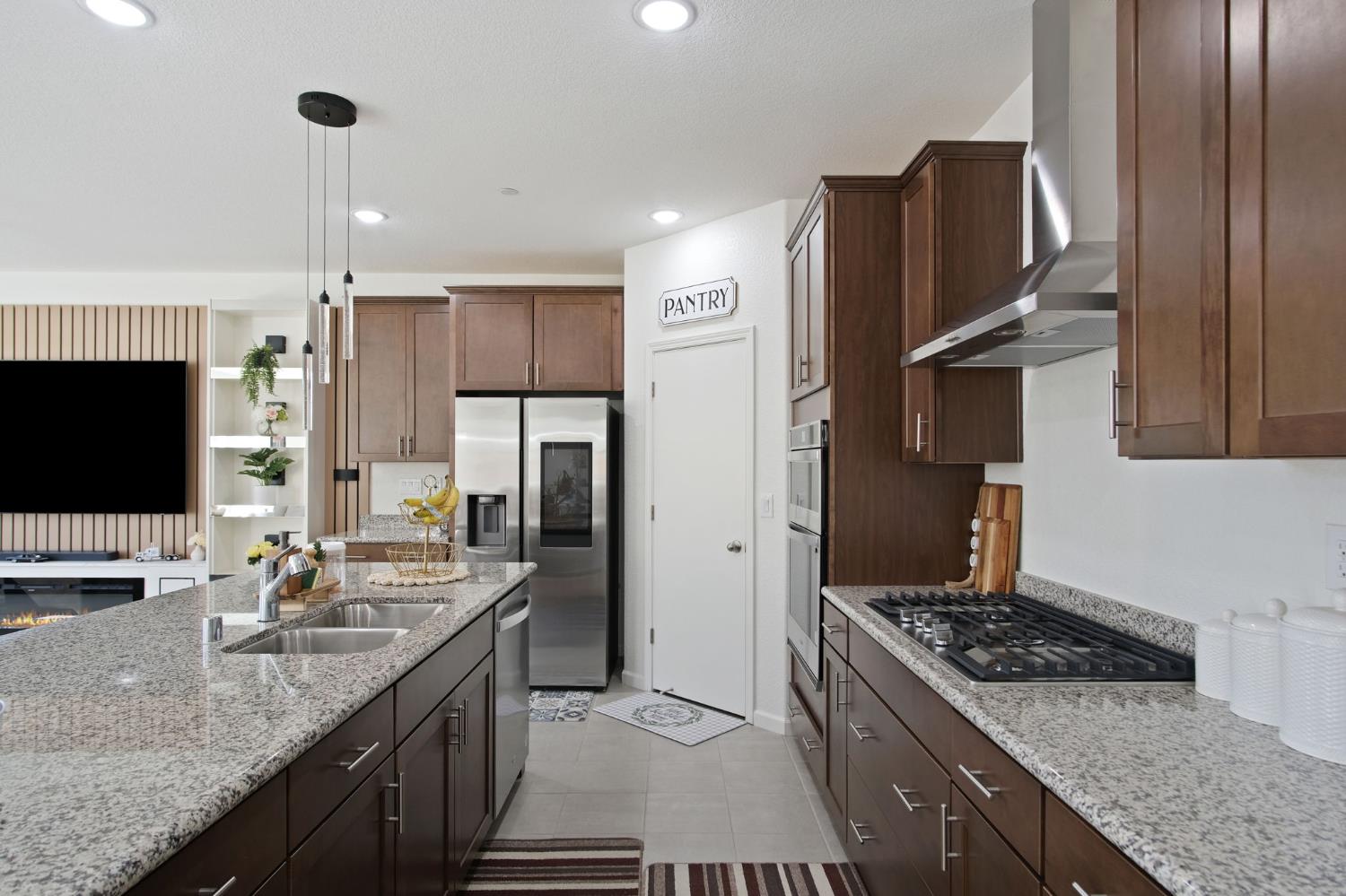 1432 Meridian Street Manteca, CA 95337 - Photo 14 of 42 a kitchen with stainless steel appliances granite countertop a sink stove and refrigerator