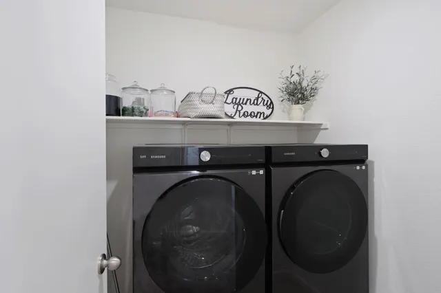 a utility room with dryer and washer