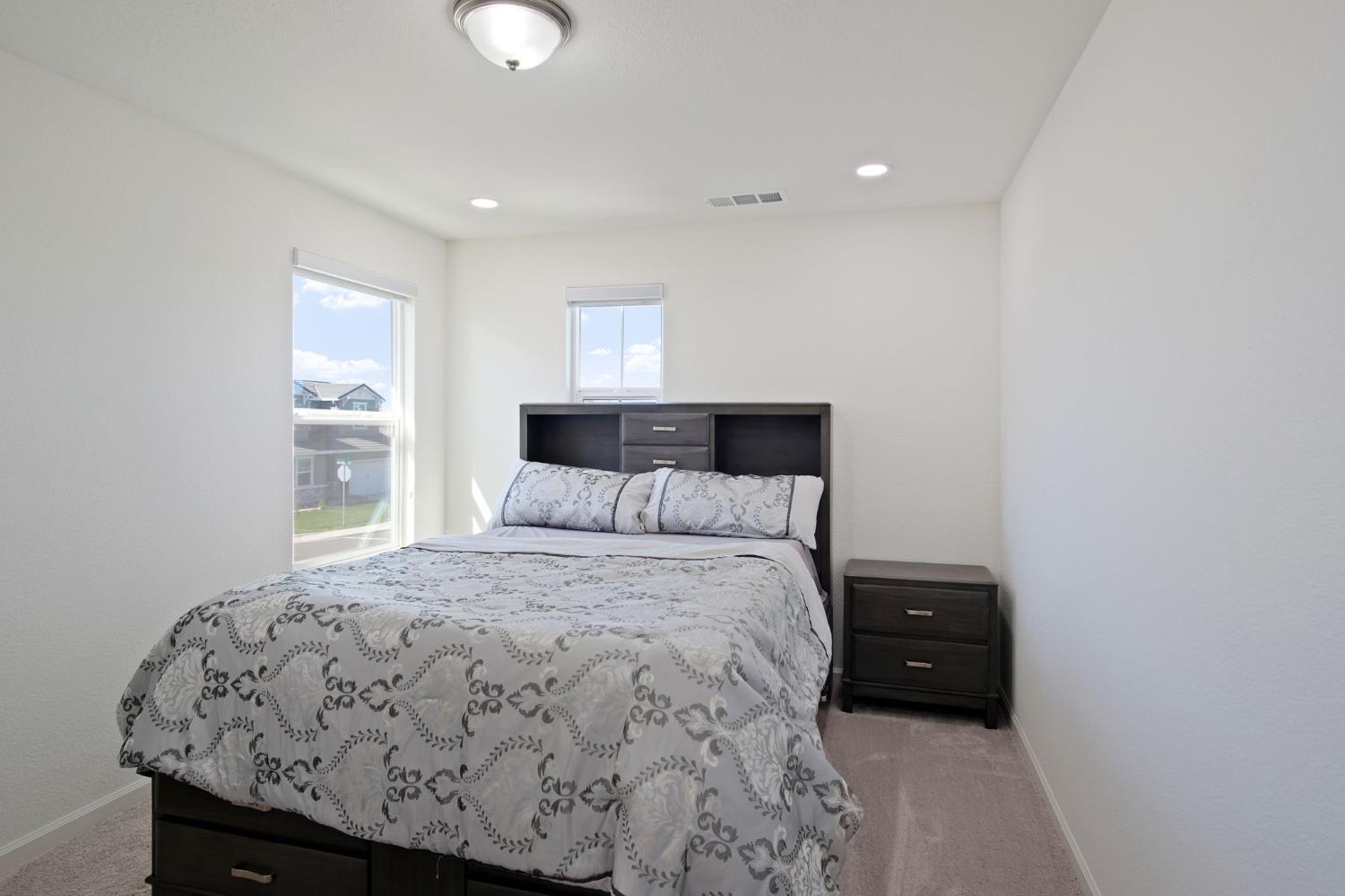 1432 Meridian Street Manteca, CA 95337 - Photo 23 of 42 a bedroom with a bed and window