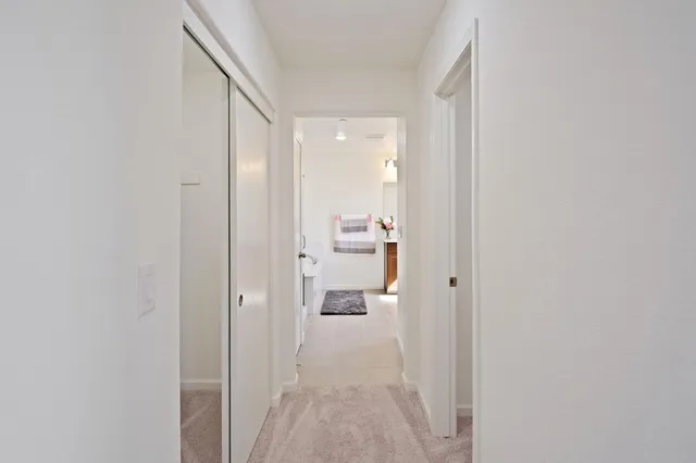 a view of a bathroom from a hallway