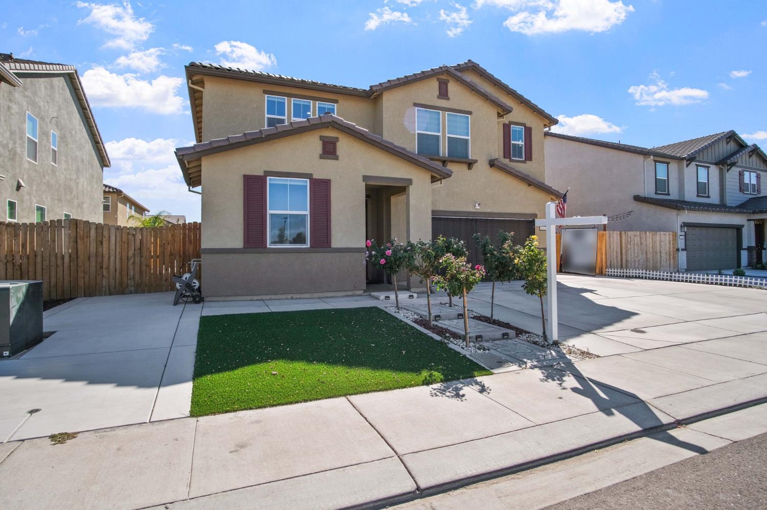 1432 Meridian Street Manteca, CA 95337 - Photo 3 of 42 a front view of a house with garden