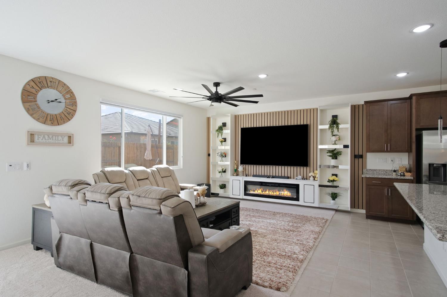 1432 Meridian Street Manteca, CA 95337 - Photo 9 of 42 a living room with furniture and a flat screen tv