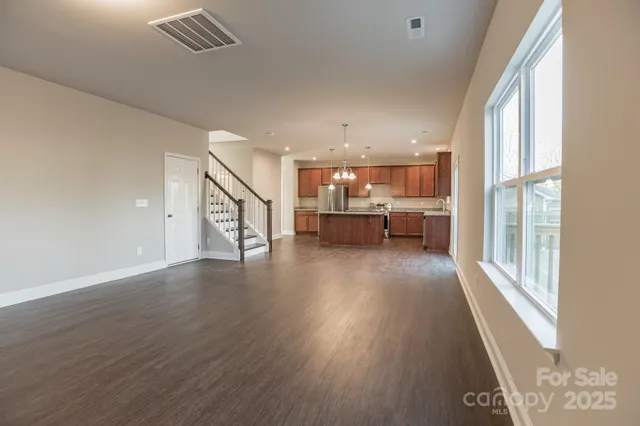 a view of dining room with furniture wooden floor and windows
