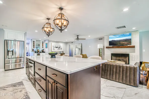 a spacious bathroom with a sink mirror and vanity