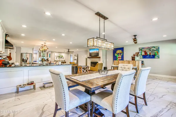 a bathroom with a sink a toilet a mirror a vanity and shower