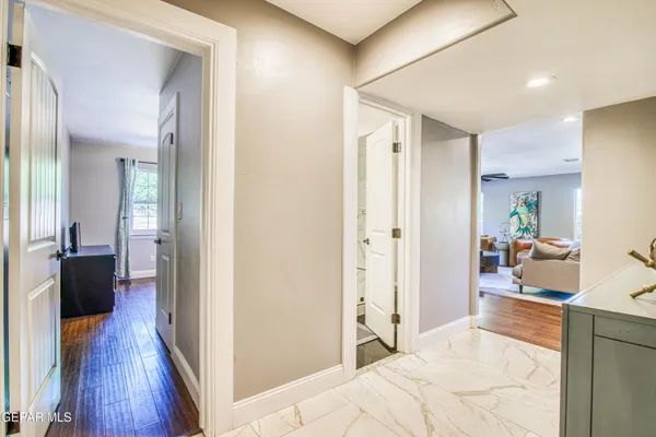 a bed room with a bed and a chandelier