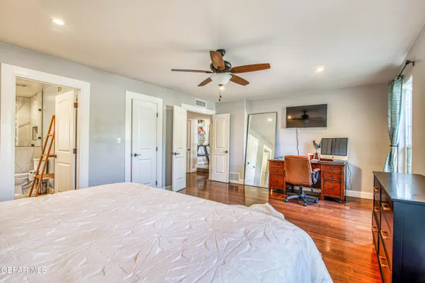a dining room with furniture and wooden floor